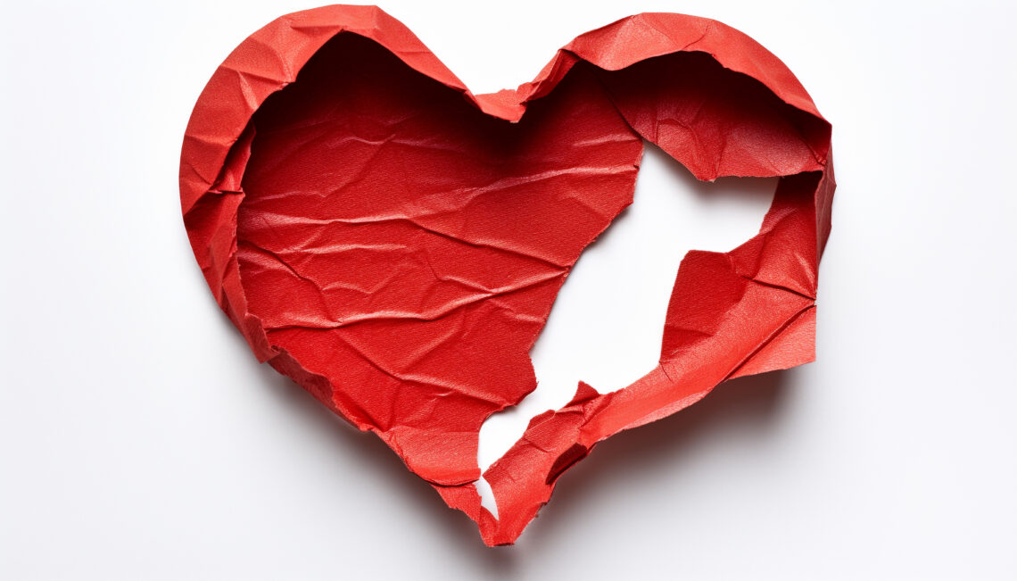 a red heart with a hole in it