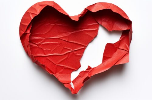 a red heart with a hole in it
